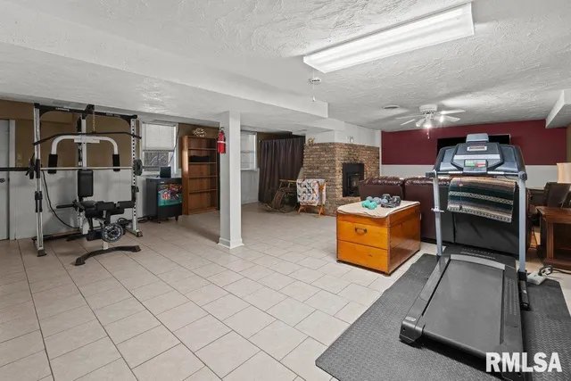 a kitchen with stainless steel appliances kitchen island granite countertop a refrigerator and a stove