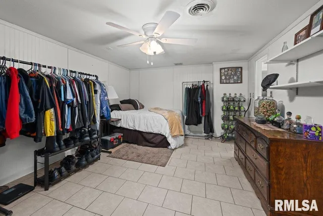 a bed room with a bed and a walk in closet