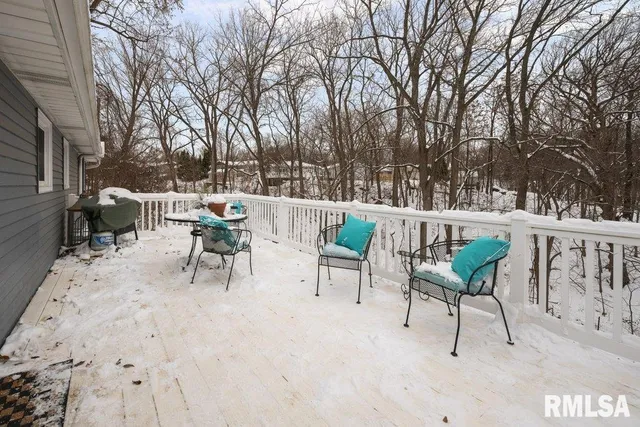 a view of a terrace with furniture and trees