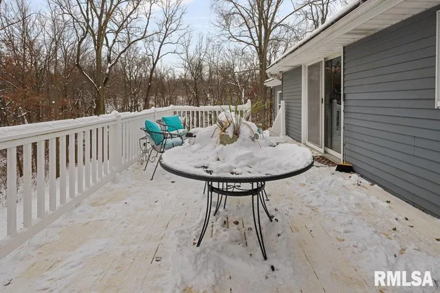 a view of backyard with a tub and trees