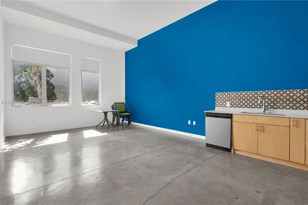a view of a livingroom with a furniture and a window
