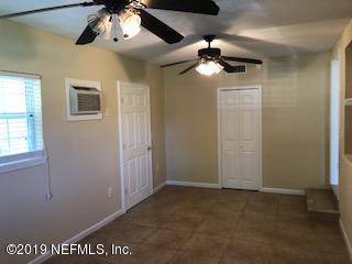 2002 Clemson Road Jacksonville, FL 32217 - Photo 11 of 15 a view of a chandelier fan in a room