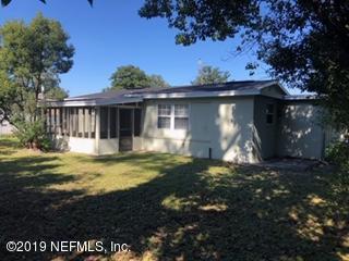 2002 Clemson Road Jacksonville, FL 32217 - Photo 15 of 15 a view of a house with backyard and sitting area