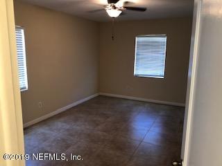 2002 Clemson Road Jacksonville, FL 32217 - Photo 5 of 15 an empty room with a window