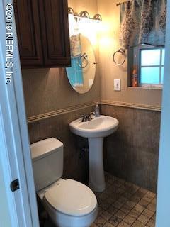 2002 Clemson Road Jacksonville, FL 32217 - Photo 7 of 15 a bathroom with a sink toilet and mirror