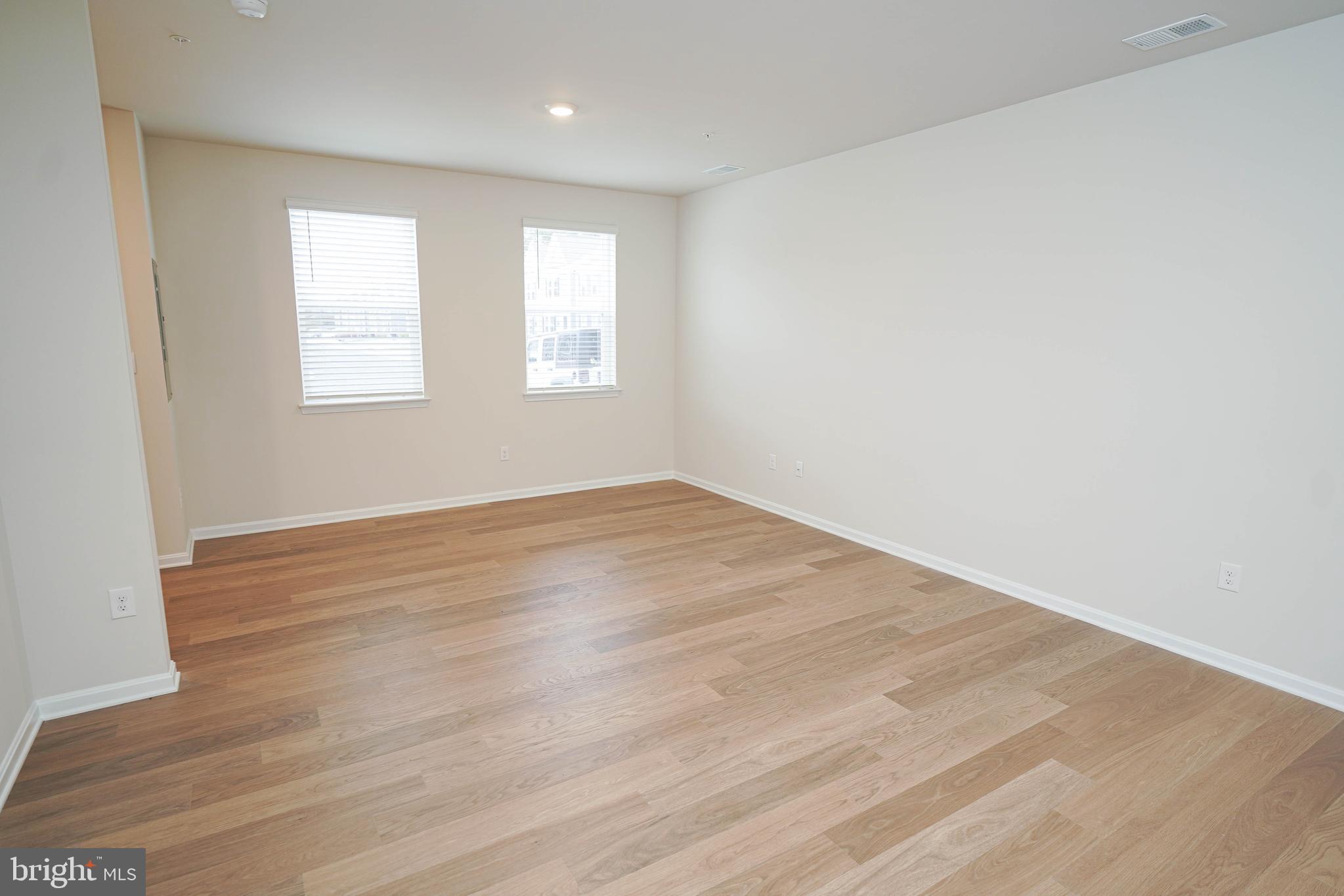852 Mersey Lane Salisbury, MD 21801 - Photo 11 of 40 wooden floor in an empty room with a window