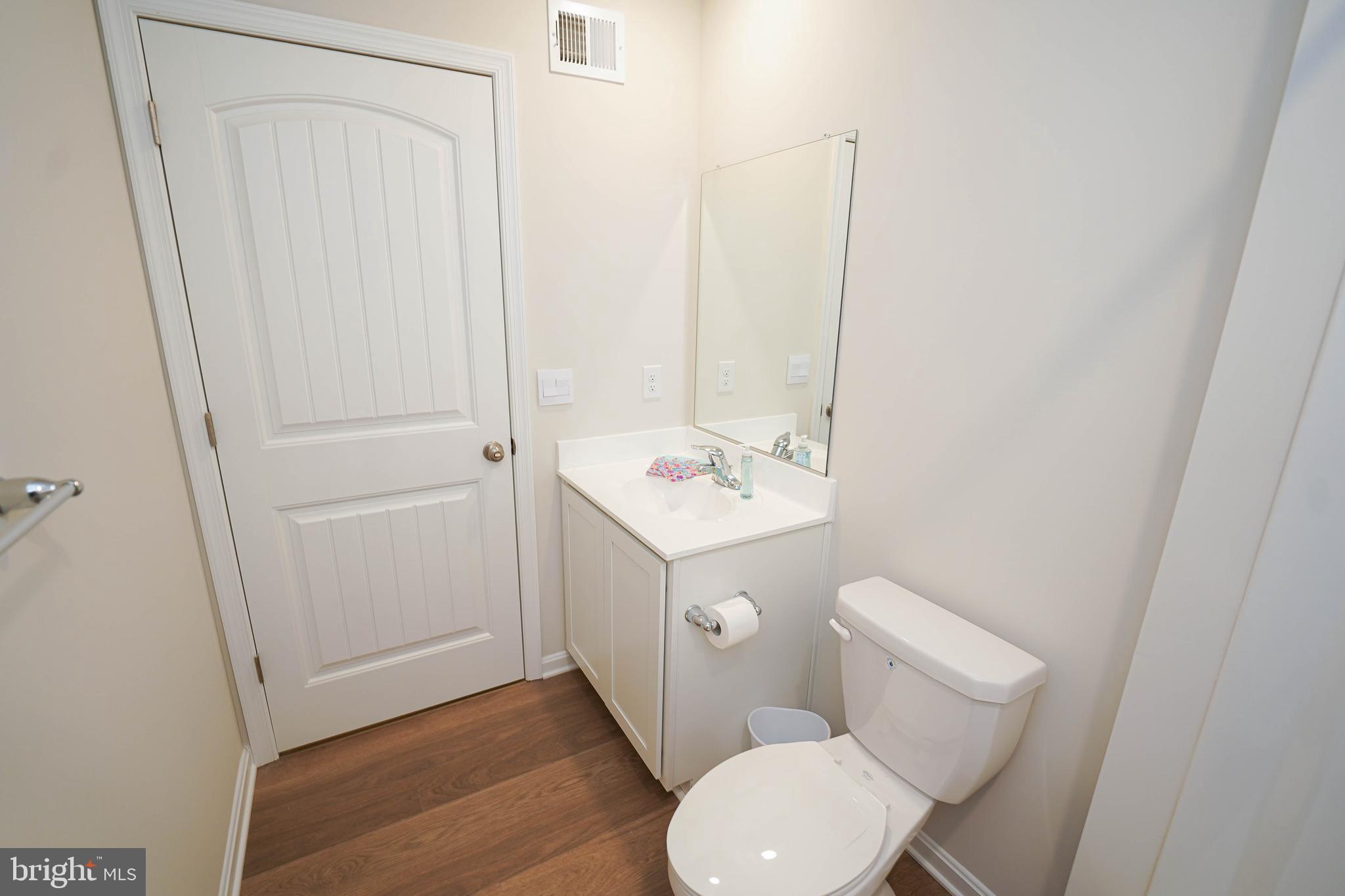 852 Mersey Lane Salisbury, MD 21801 - Photo 35 of 40 a white toilet sitting next to a bathroom sink