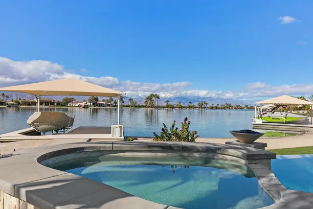 a front view of a house with a garden and plants