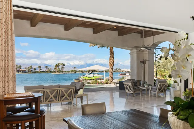 a spacious bedroom with a large bed and a large window