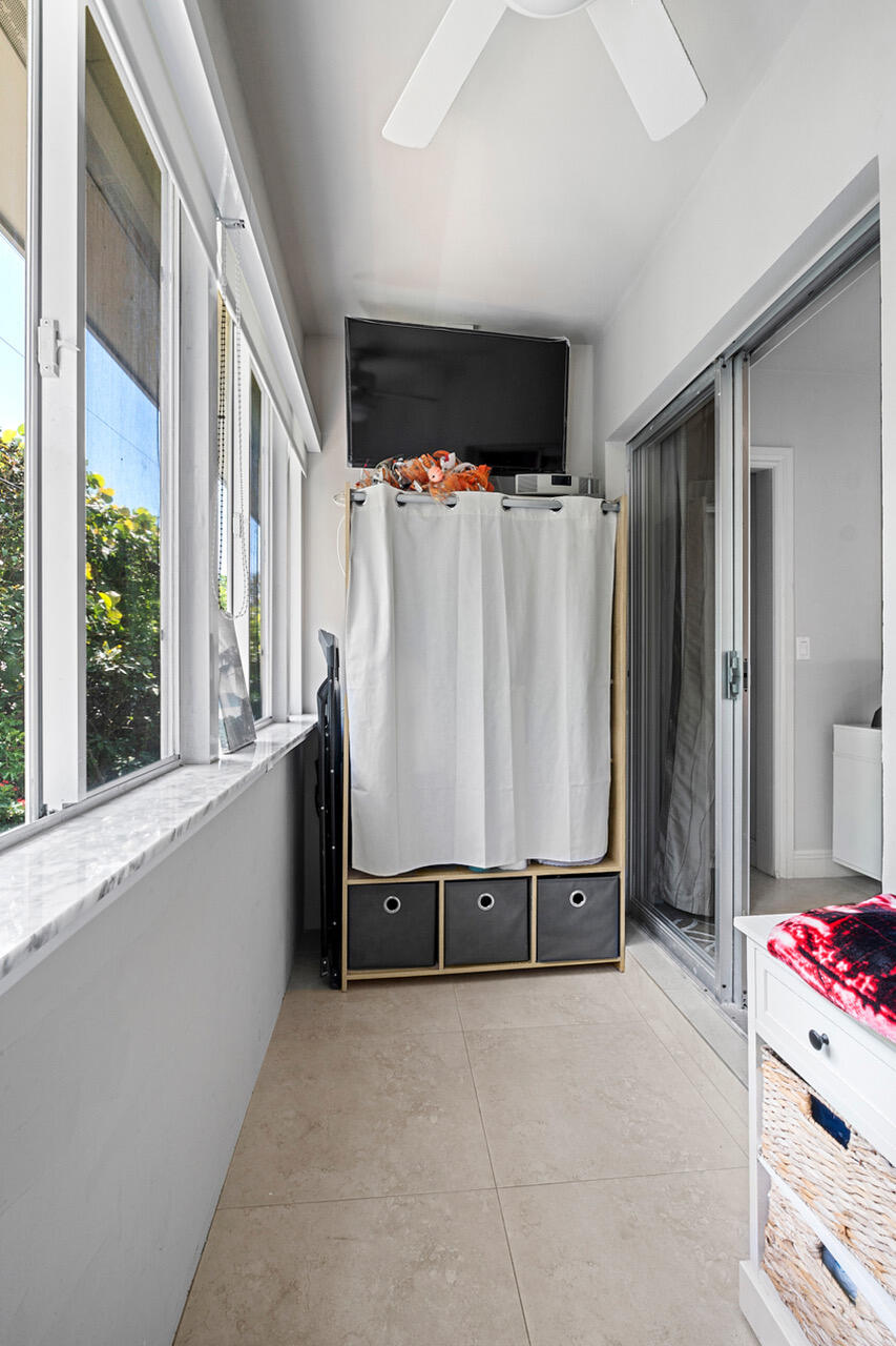 5505 North Ocean Boulevard, Unit 3203 Ocean Ridge, FL 33435 - Photo 12 of 25 a view of a bedroom with furniture and window