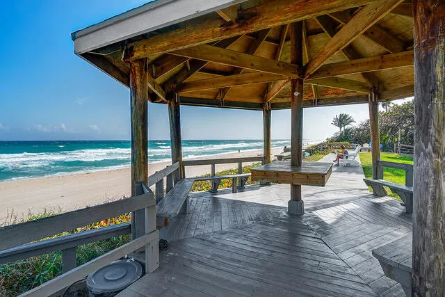 a view of a patio with wooden floor