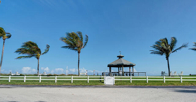 5505 North Ocean Boulevard, Unit 3203 Ocean Ridge, FL 33435 - Photo 17 of 25 a view of a bench in front of a house