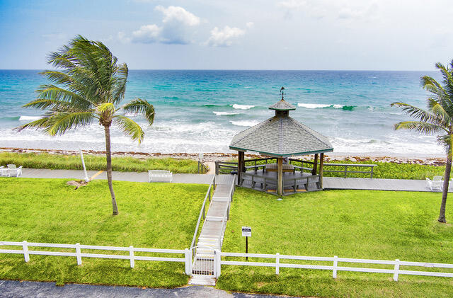 5505 North Ocean Boulevard, Unit 3203 Ocean Ridge, FL 33435 - Photo 18 of 25 a view of a swimming pool with a yard