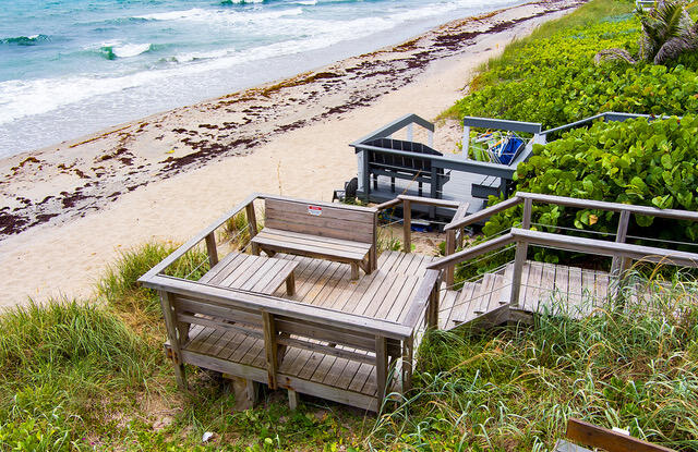5505 North Ocean Boulevard, Unit 3203 Ocean Ridge, FL 33435 - Photo 19 of 25 a balcony with outdoor seating and wooden floor