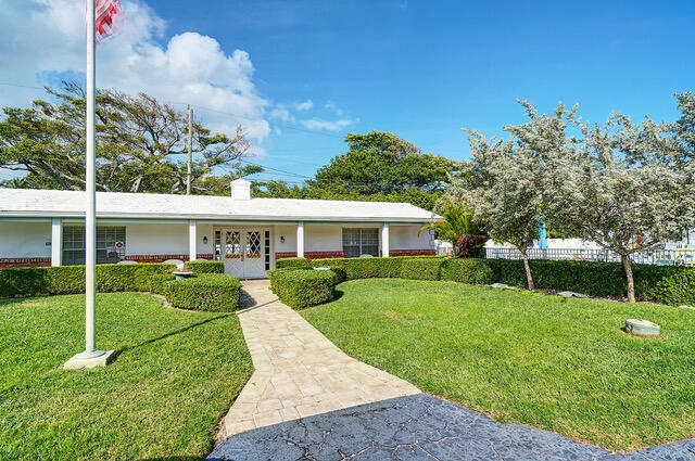 5505 North Ocean Boulevard, Unit 3203 Ocean Ridge, FL 33435 - Photo 24 of 25 a view of a house with a yard
