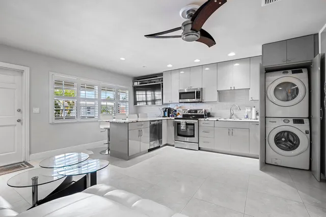 a kitchen with a stove cabinets and a refrigerator