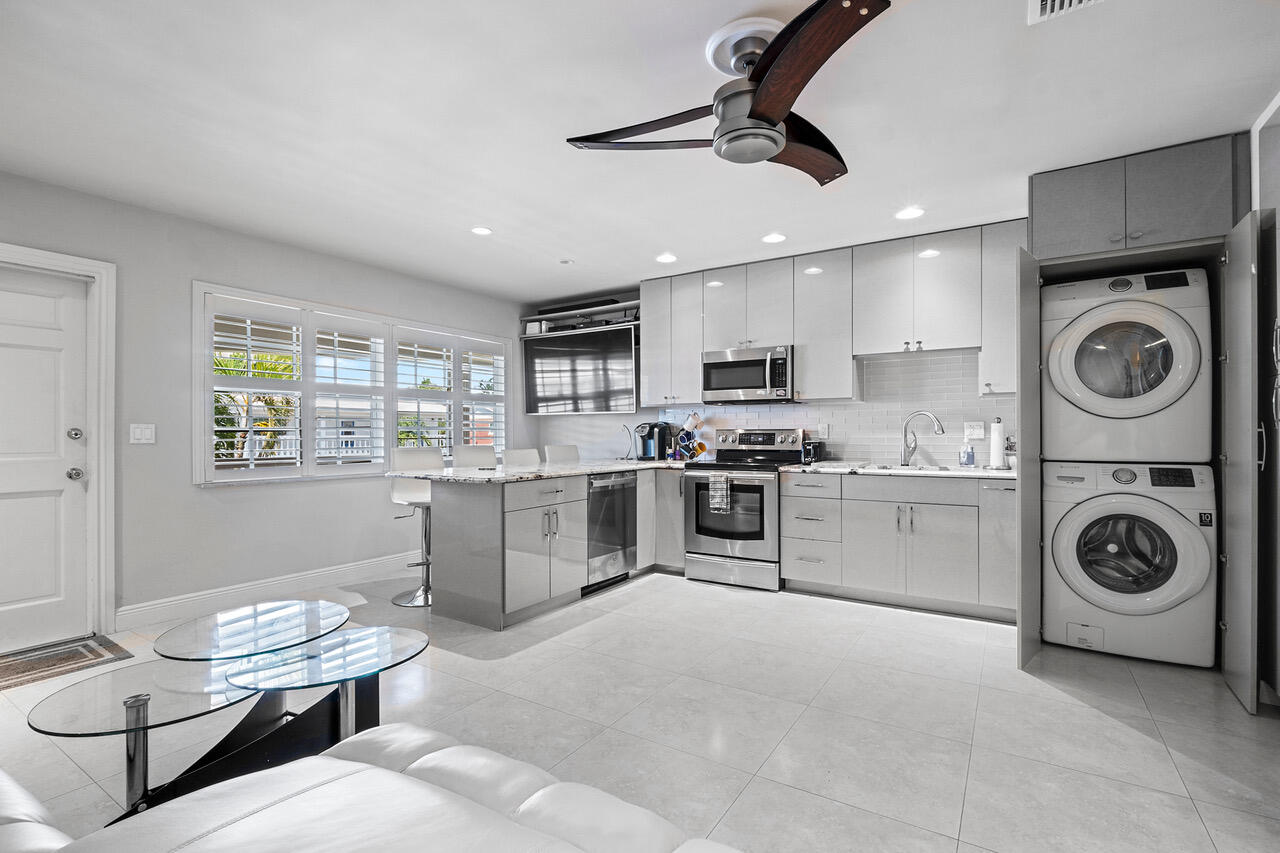 5505 North Ocean Boulevard, Unit 3203 Ocean Ridge, FL 33435 - Photo 7 of 25 a kitchen with a stove cabinets and a refrigerator