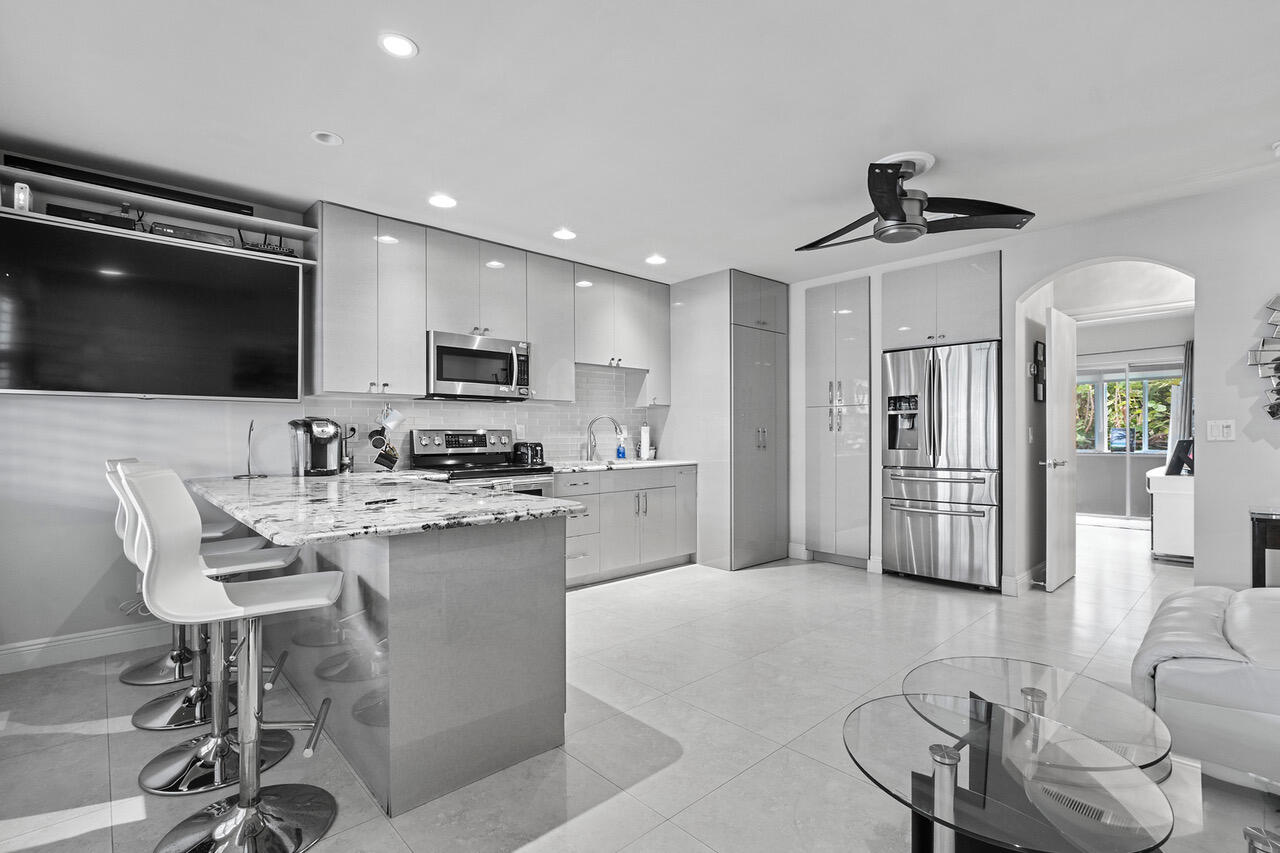 5505 North Ocean Boulevard, Unit 3203 Ocean Ridge, FL 33435 - Photo 8 of 25 a view of kitchen with sink microwave and refrigerator