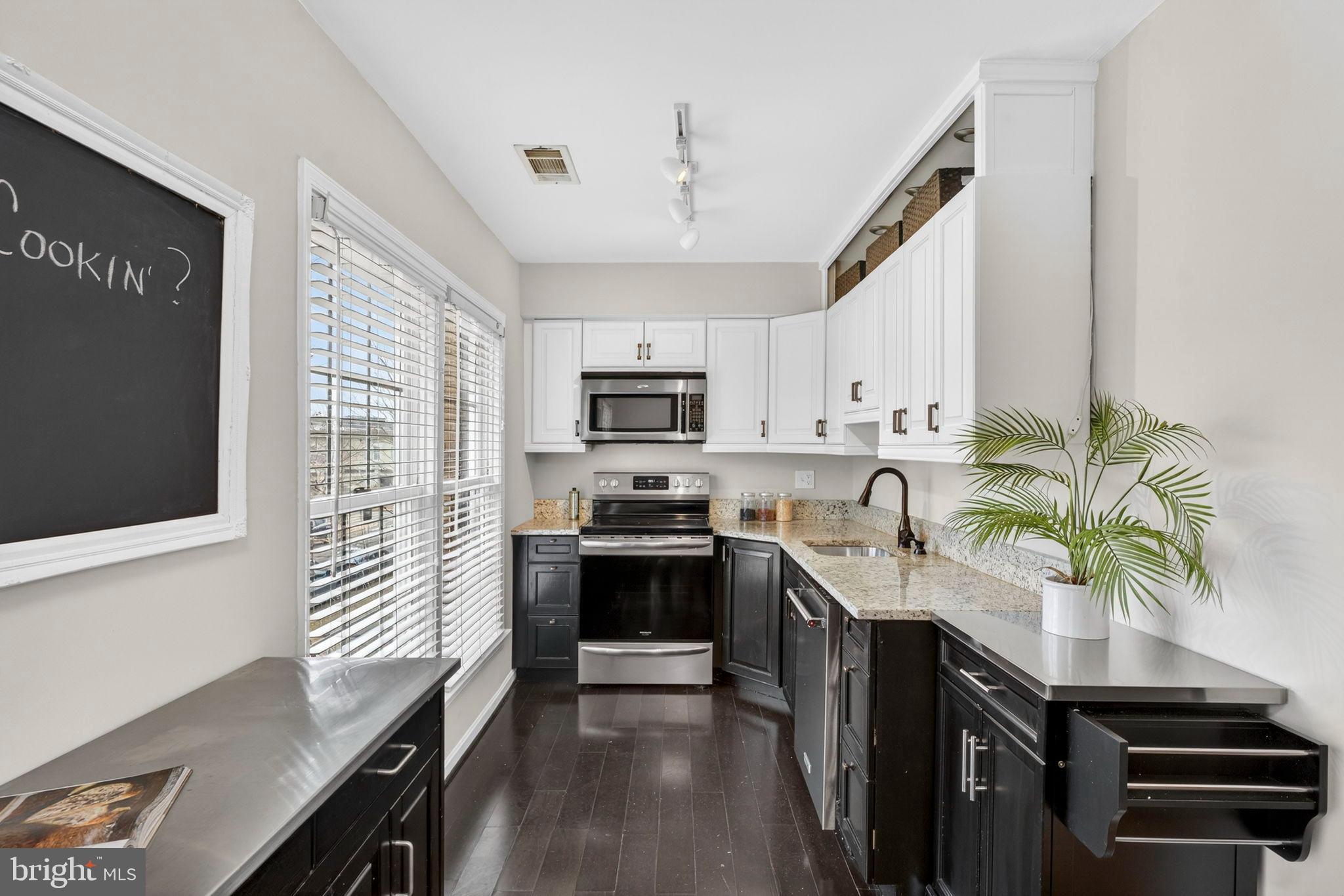 1117 G Street Southeast Washington, DC 20003 - Photo 11 of 50 Modern kitchen with sleek cabinetry and light.
