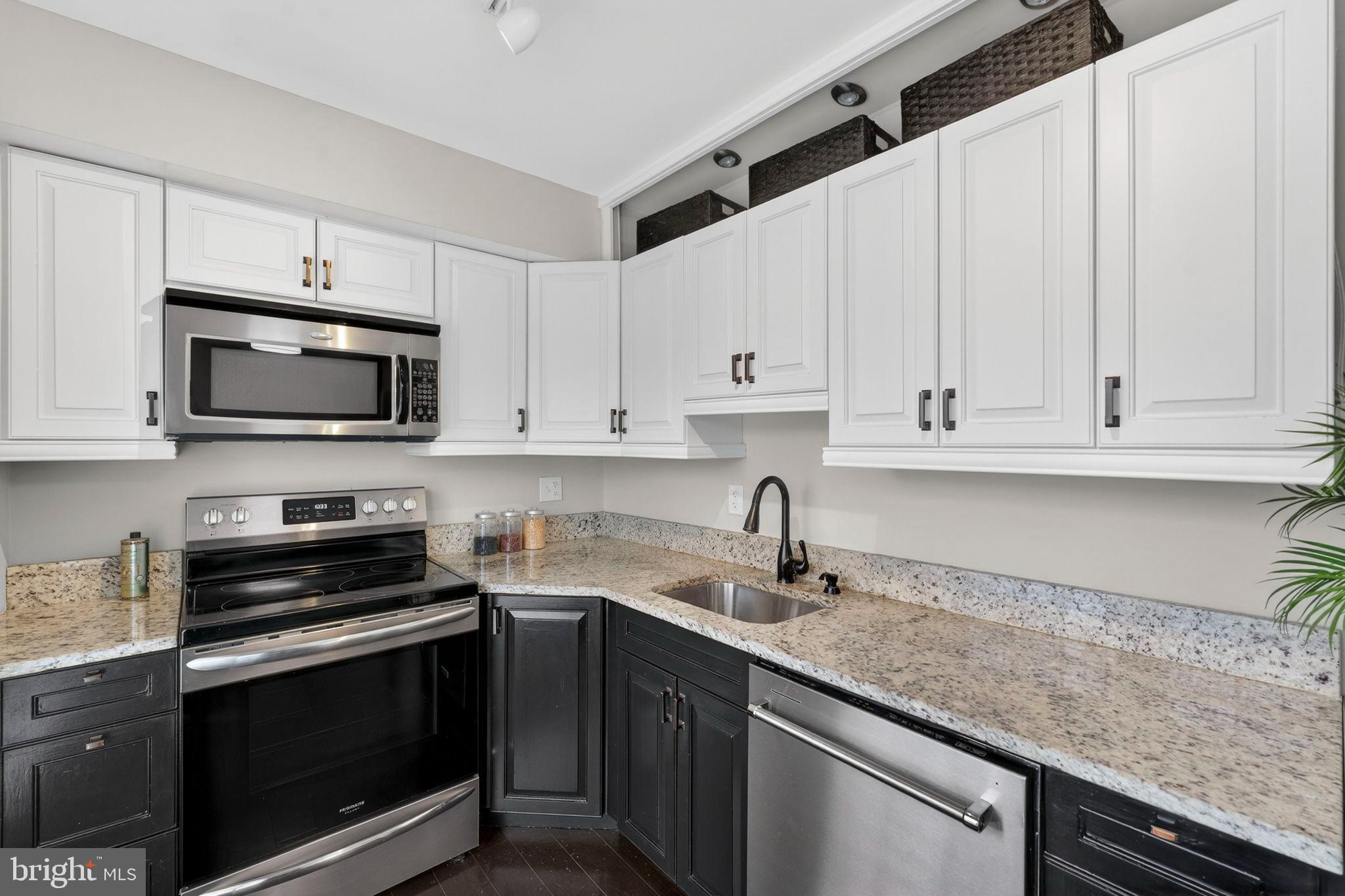 1117 G Street Southeast Washington, DC 20003 - Photo 16 of 50 Modern kitchen with sleek cabinetry and granite.