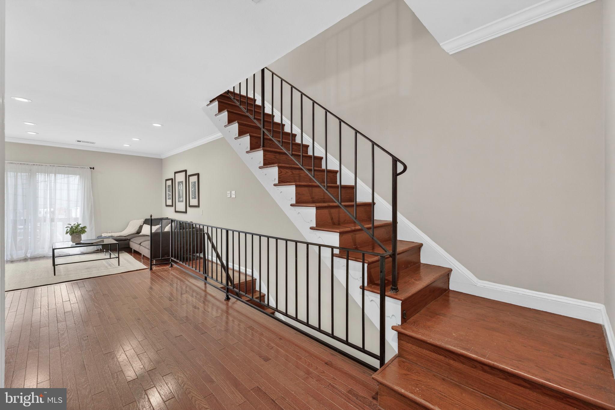 1117 G Street Southeast Washington, DC 20003 - Photo 20 of 50 Elegant entryway with a sweeping staircase.