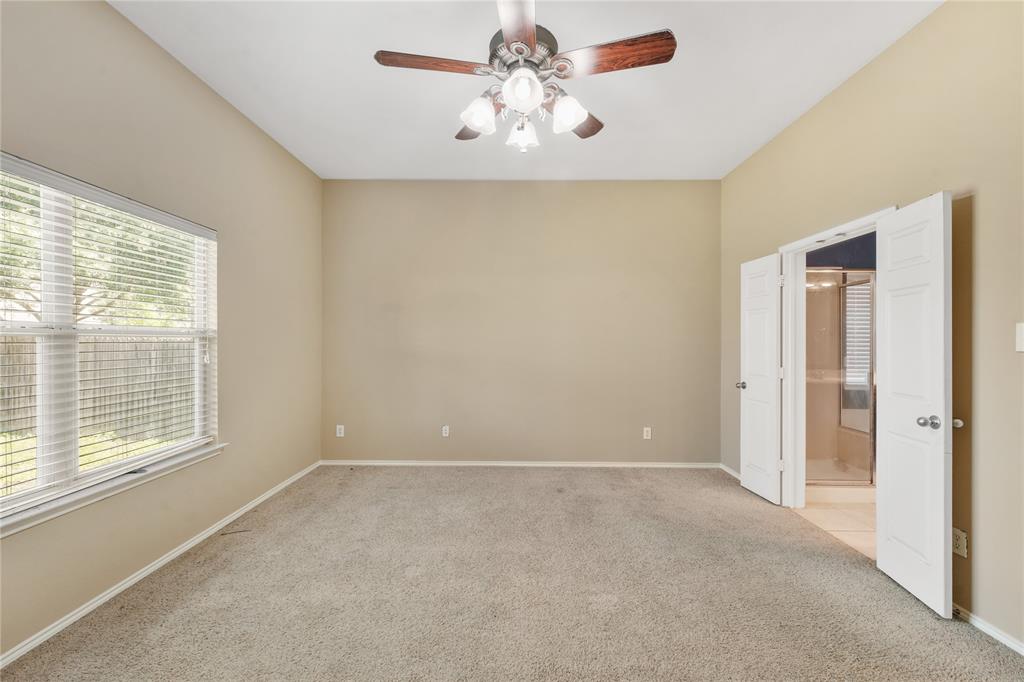 2003 Diamondback Forney, TX 75126 - Photo 14 of 30 Empty room featuring light colored carpet and ceiling fan