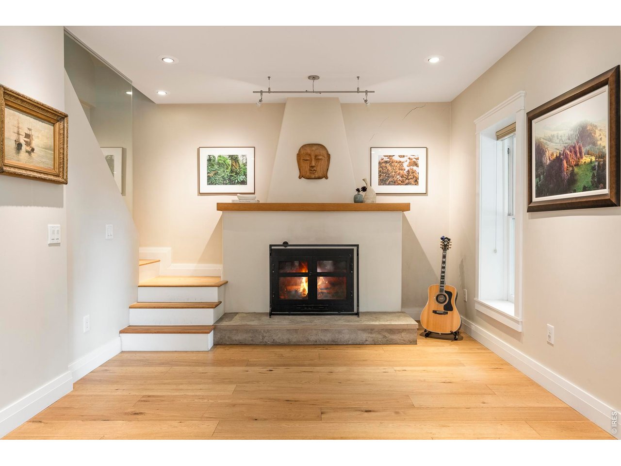 3231 11th Street Boulder, CO 80304 - Photo 13 of 39 a living room with a fireplace and a floor to ceiling window