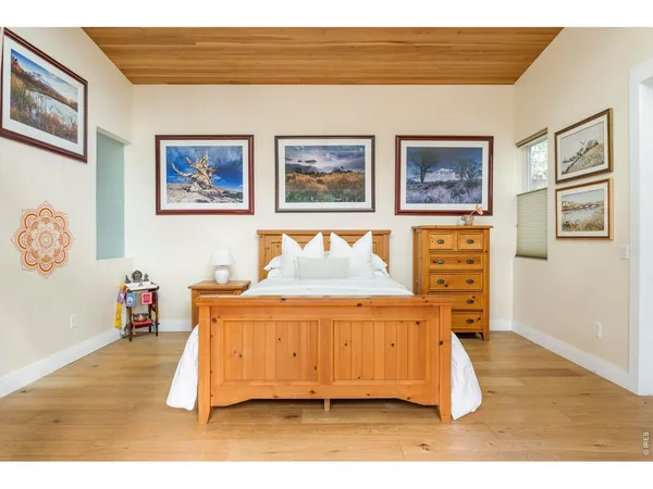 a bedroom with a bed and a cabinets