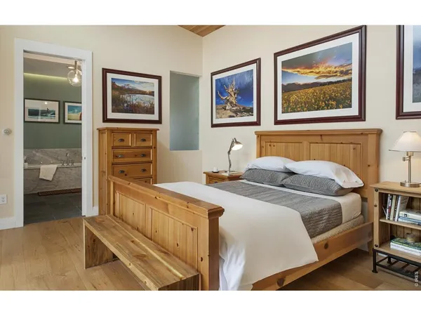 a bathroom with a sink a mirror and a shower