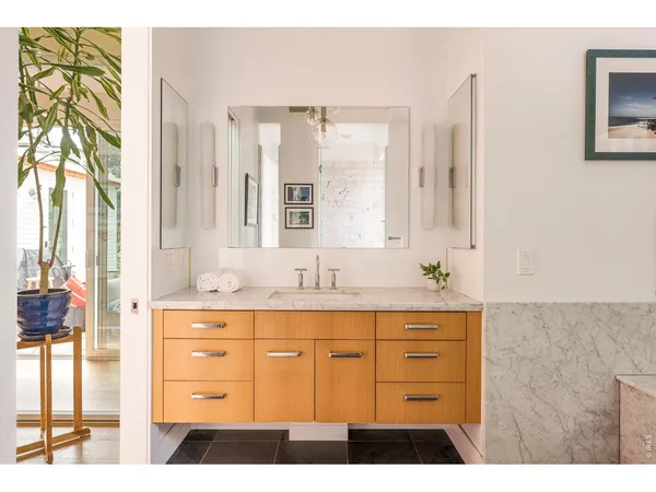 a bedroom with a bed and a view of bathroom