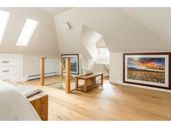 a view of a living room with lots of furniture