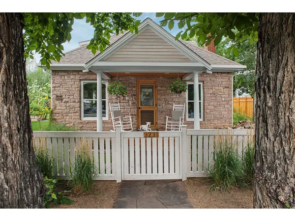 a view of a porch with furniture and garden