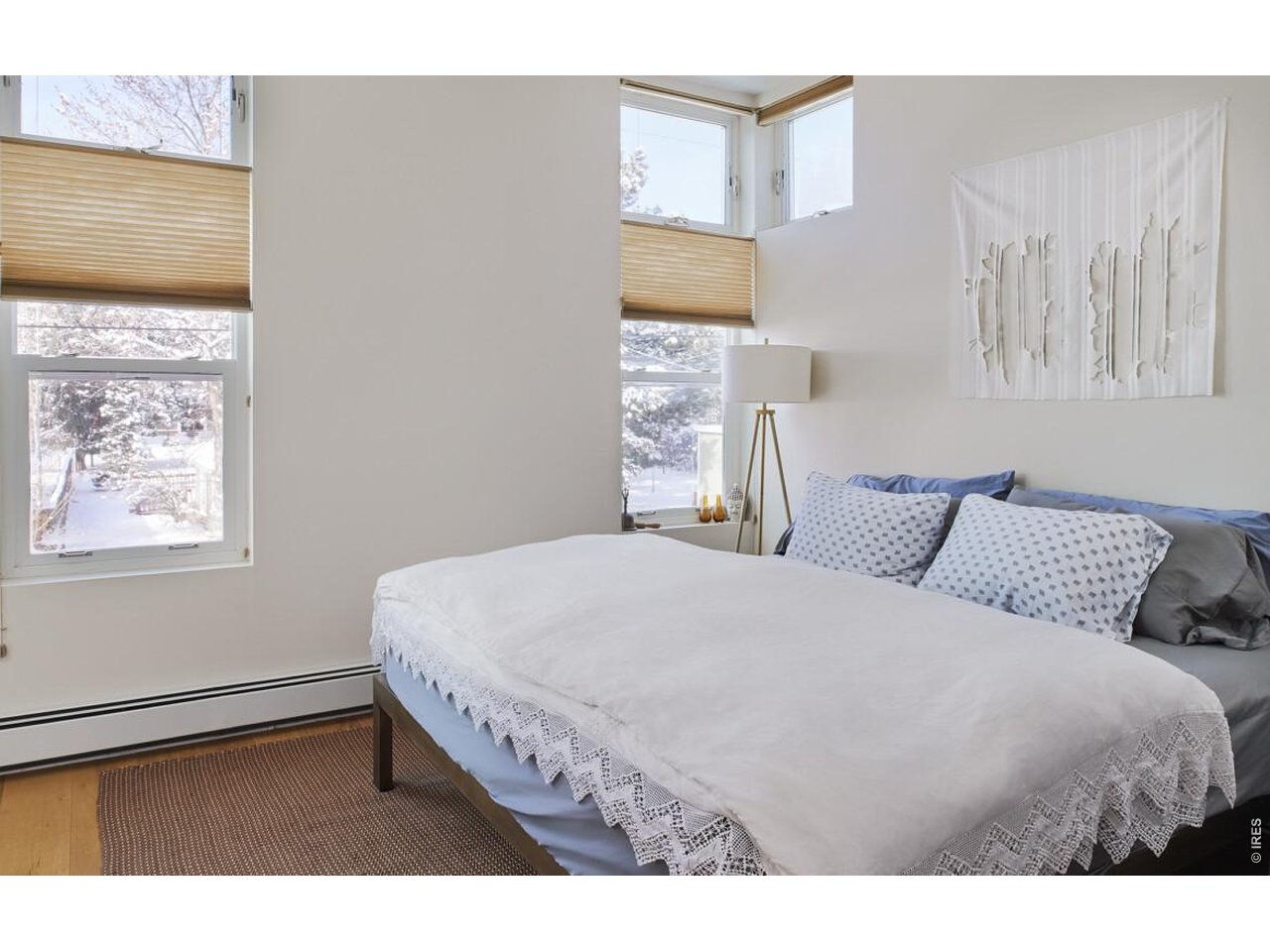 3231 11th Street Boulder, CO 80304 - Photo 37 of 39 a bedroom with a bed and a window