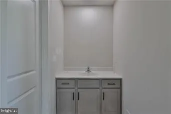 a bathroom with a sink and vanity