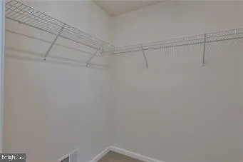 a view of a room with racks on the wall