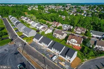 an aerial view of a house with a garden