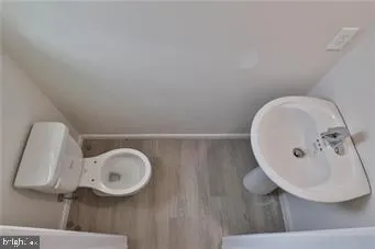 a bathroom with a sink and mirror