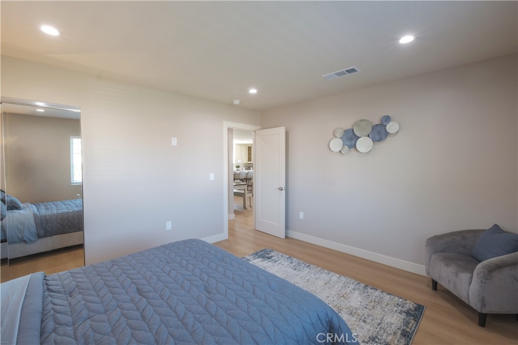 223 South Aprilia Avenue Compton, CA 90220 - Photo 12 of 46 a bedroom with bed and window
