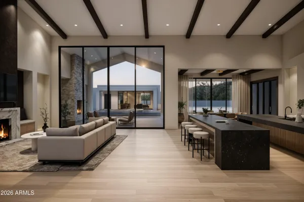 a living room with furniture a large window and a flat screen tv