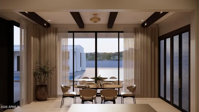 a view of a dining room with furniture and window