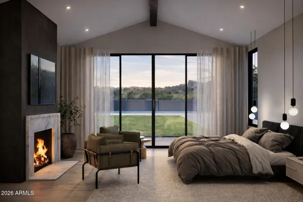a bedroom with a bed and a fireplace