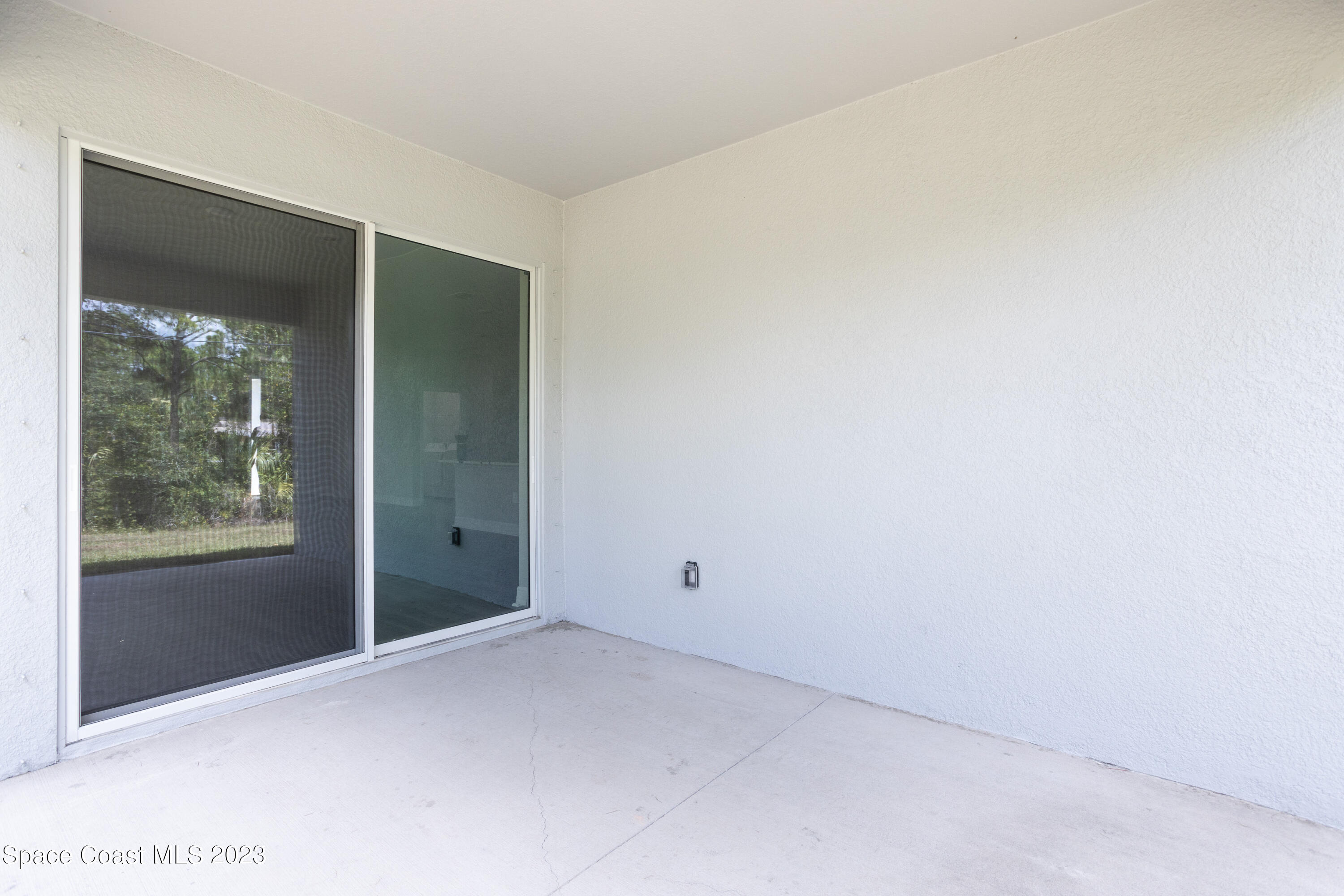1007 San Rafael Road Southwest Palm Bay, FL 32908 - Photo 20 of 23 a view of an empty room with a window