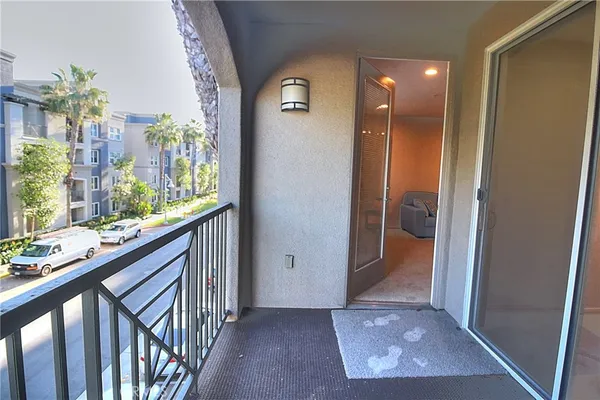 a view of hallway with furniture and a window