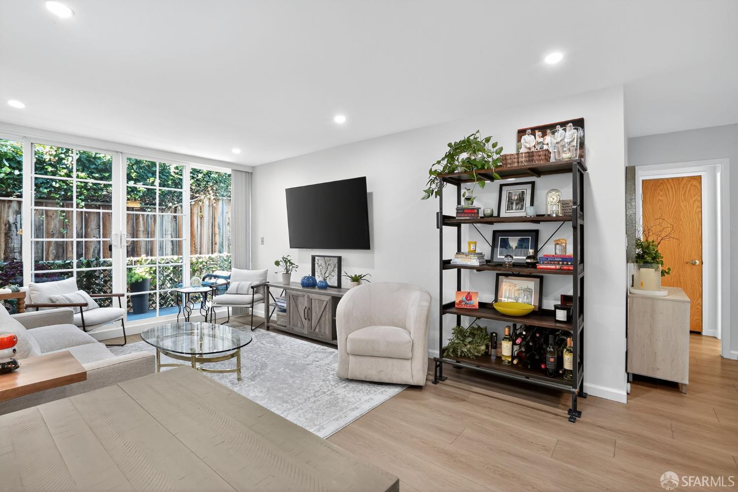 222 Laurel Street, Unit 109 San Carlos, CA 94070 - Photo 16 of 27 a living room with furniture and a flat screen tv