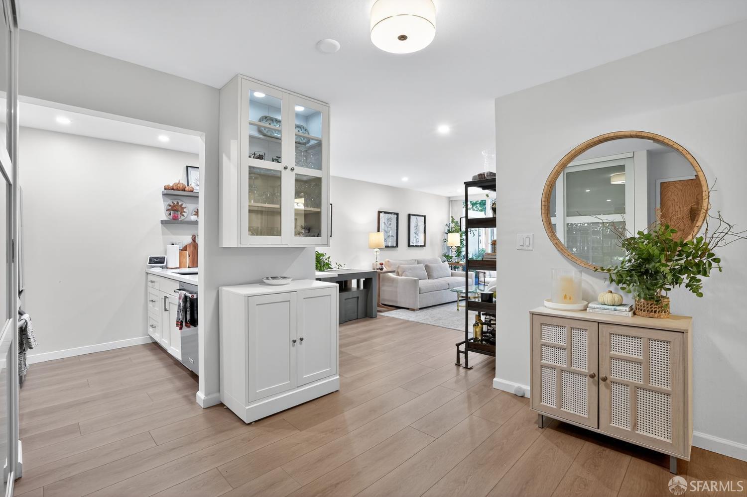 222 Laurel Street, Unit 109 San Carlos, CA 94070 - Photo 17 of 27 a kitchen with a white cabinets and chandelier