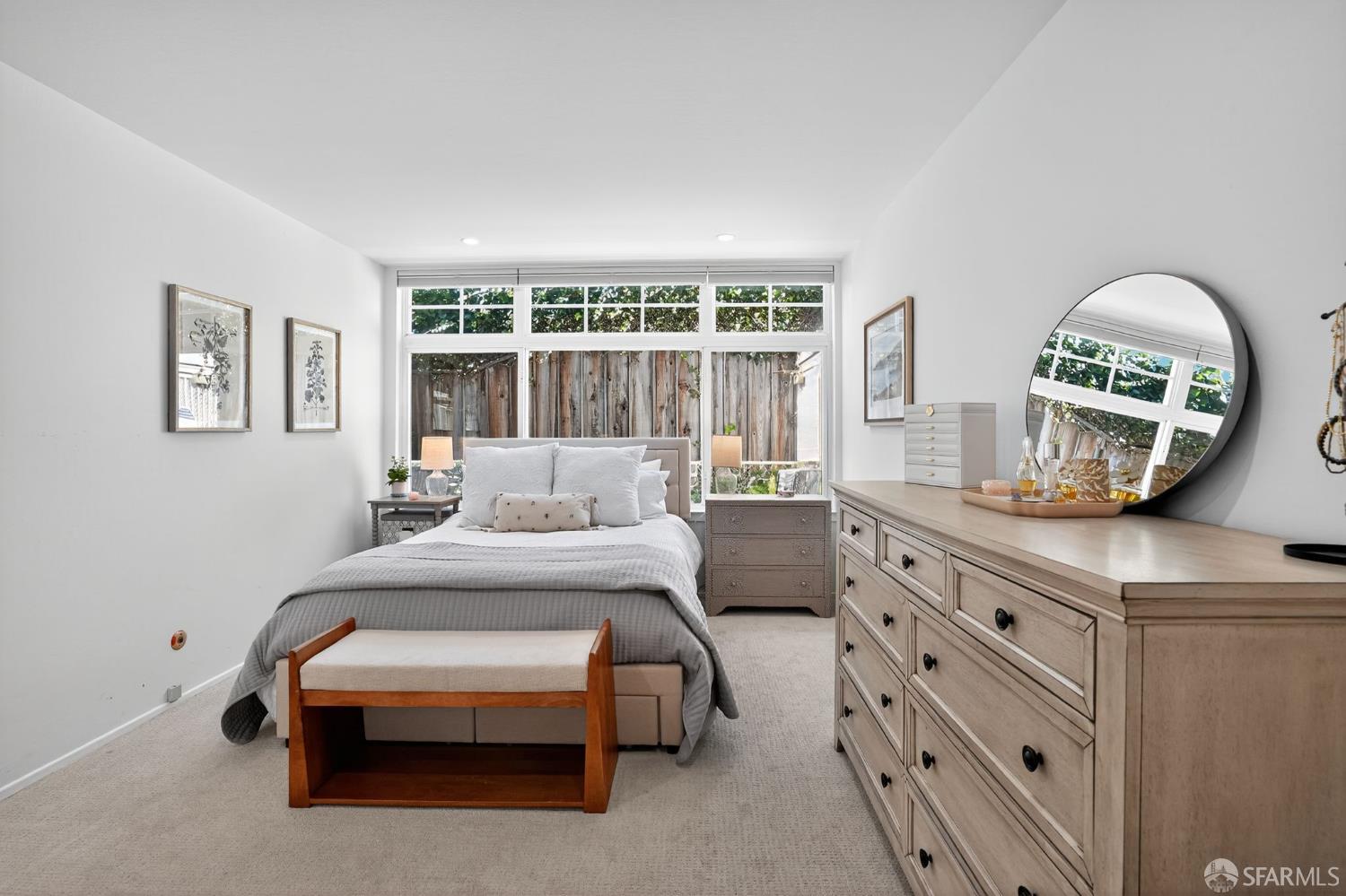 222 Laurel Street, Unit 109 San Carlos, CA 94070 - Photo 20 of 27 a bedroom with a bed a table and window