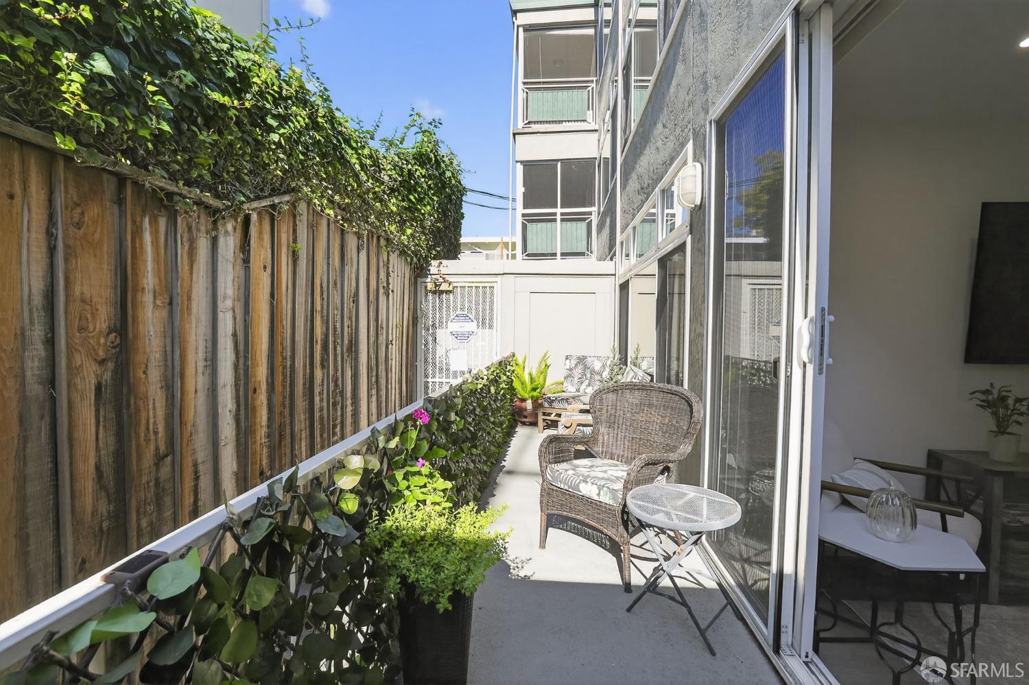 222 Laurel Street, Unit 109 San Carlos, CA 94070 - Photo 24 of 27 a view of a balcony with chair and potted plant