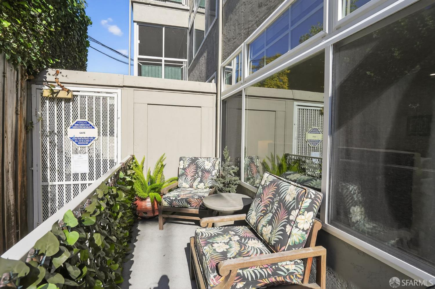 222 Laurel Street, Unit 109 San Carlos, CA 94070 - Photo 25 of 27 a view of a balcony with chairs potted plants