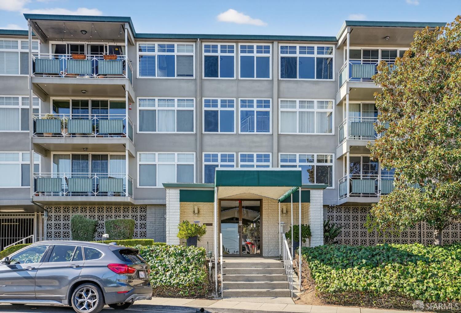 222 Laurel Street, Unit 109 San Carlos, CA 94070 - Photo 26 of 27 a front view of a building with parking space