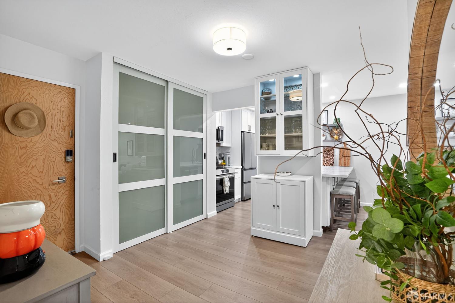 222 Laurel Street, Unit 109 San Carlos, CA 94070 - Photo 5 of 27 a room with a wooden floor and a toilet